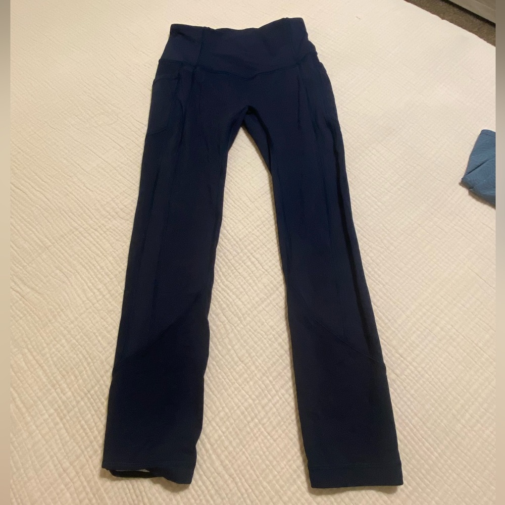 Lululemon size 4 navy leggings with pockets. Worn ONCE